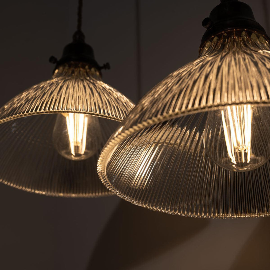 Pair of Antique Holophane Pendant Lights with Aged Copper Fittings