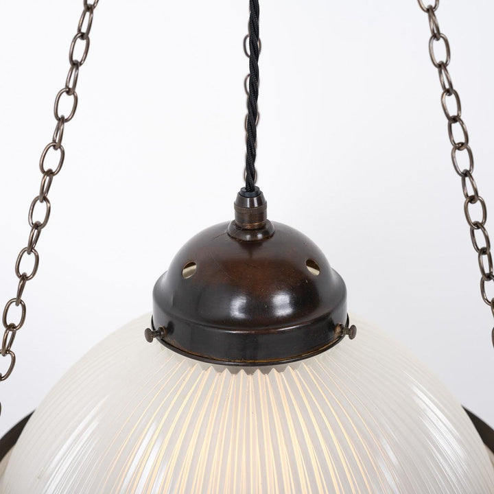 Rare Trio of Antique Holophane 'STEPLITE" three part pendant lights with aged brass fittings