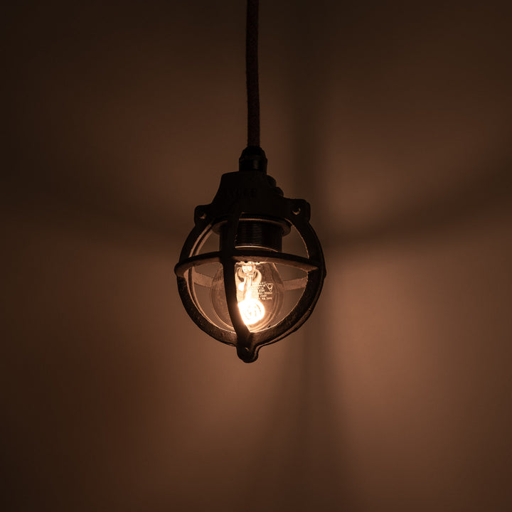 Set of Three Atlas Cast Iron Globe Cage Pendants — Industrial Bulb Guards